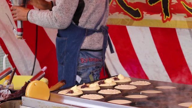 Japanese Street Food Vendor Cooks Traditional Dessert Imagawayaki At Market In Japan