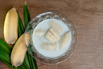 Thai banana dessert on wooden background