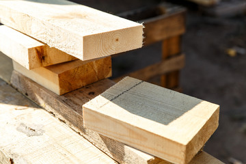 Sawn wooden Board on a sawmill close-up. The concept of working with wood on a sawmill. Material for construction.