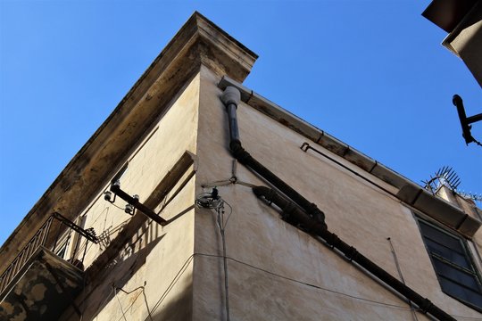 evocative image of the corner of an ancient building in the historic center of Palermo in Italy