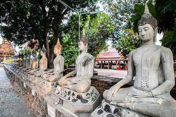 Buddha statues inside Wat Yai Chai Mongkhon, a Buddhist temple of archaeological park, Ayutthaya, Thailand