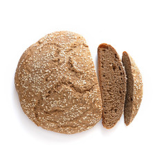Homemade whole grain round bread isolated on a white background.