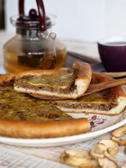 Pastry background.A large round open pie filled with dried Apple chips. Delicious dessert for tea.