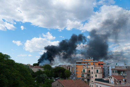 Black smoke caused by a fire in the Centocelle district of Rome
