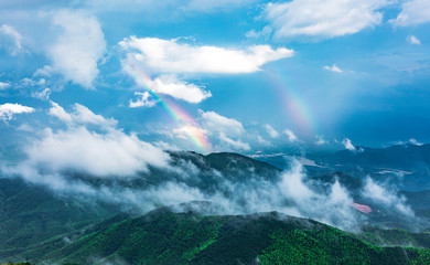 Beautiful rainbow on the mountain after summer rain