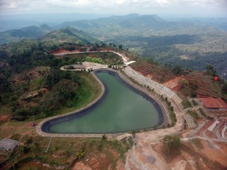 the lake above the hill to accommodate rainwater