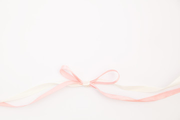 isolated pink satin silk atlas ribbon white background
