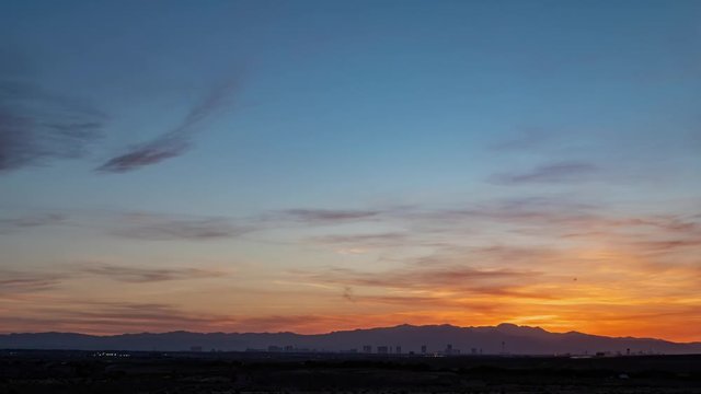 Sunset time lapse of the beautiful strip skyline with red clouds