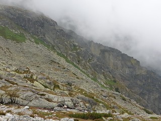 Mountain peak landscape with clouds in summer