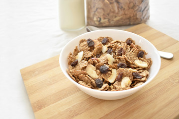 Fruit and fiber cereal on a bowl. The concept of healthy breakfast, healthy food, dietary plan and weight loss program. Selective focus. Copy space is on the left side.