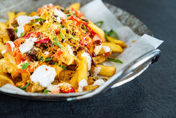 french fries with minced meat, beans and vegetables