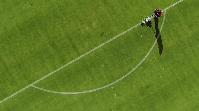 Top view of Marking football stadium field using a professional paint machine