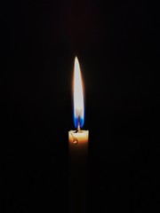 Dramatic candle in the dark