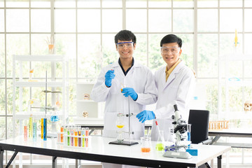 Science, Chemistry, Technology, Biology and Laboratory concept - Portrait of Asian senior and...