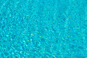 Blue Water sun Reflections on swimming pool  background Texture