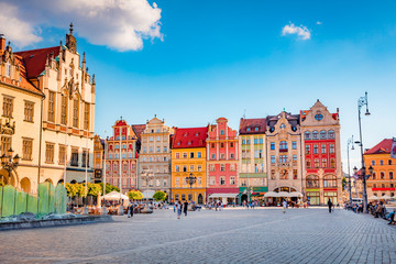 Fototapeta na wymiar Stunning morning cityscape of Wroclaw, historical capital of Silesia with beautiful old houses, Poland, Europe. Wonderful summer view of Market Square. Traveling concept background..