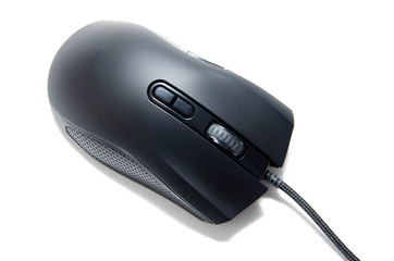 Black gaming mouse with side extra keys and a matte finish on white background. Mouse front view...