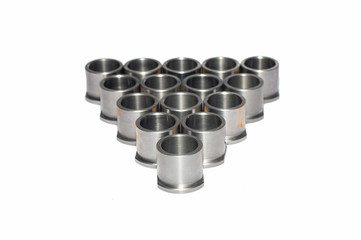 group of bushing parts from precess lathe machine on white background