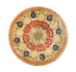 top view of vintage indian handcrafted embossed brass plate isolated on white background handmade made in the middle of the 20th century