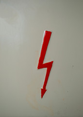 red lightning sign electronic arrow thunder and bolt  on  steel cream color