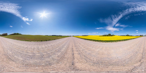 Full spherical seamless panorama 360 degrees angle view on no traffic white sand gravel road among...