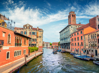 Attractive summer cityscape of Vennice with famous water canal and colorful houses. Splendid morning scene of Italy, Europe. Nice Mediterranean seascape. Traveling concept background.