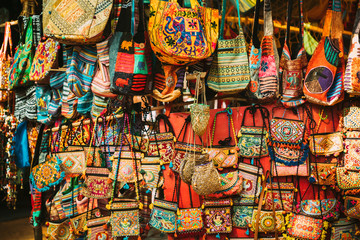 Fototapeta premium Goa, India. Traditional Store Market With Hand-sewn Bags Different Colors And Sizes