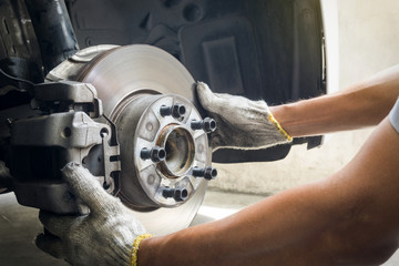 Mechanic inspection on brakes system, Service, Maintenance , Repair concept.