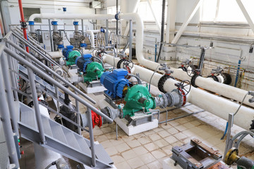 Modern pumping station at the water intake. Pipes, electric motors, pumping units.