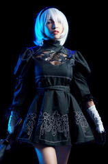 Japan anime cosplay. portrait of woman in black dress with white hair.