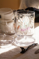 Cotton pads and cotton ear buds, the health care supplies in a bathroom 