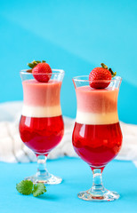 strawberry panna cotta on blue background