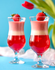 strawberry panna cotta on blue background