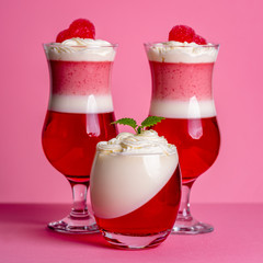 strawberry panna cotta with whipped cream in glasses