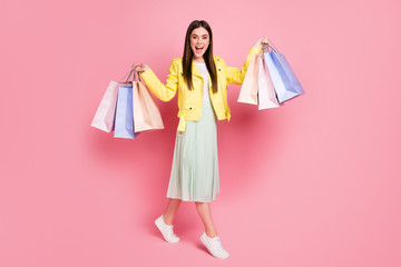 Full length photo of pretty lady hold many shopping packs buying new collection clothes wear trend...