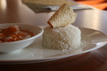 SMOKED CHICKEN BUTTER MASALA, TANDOORI MARINATED SUCCULENT CHICKEN COOKE IN SMOKED TOMATO AND CASHEW NUT GRAVY SERVED WITH STEAMED BASMATI RICE