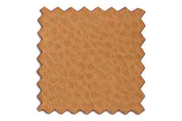 Fototapeta premium Shred of factory leather for the manufacture of accessories and various products Isolated on a white background. Cut out sample of orange leather for viewing and sewing furniture.