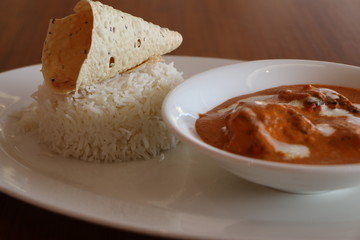 SMOKED CHICKEN BUTTER MASALA, TANDOORI MARINATED SUCCULENT CHICKEN COOKE IN SMOKED TOMATO AND CASHEW NUT GRAVY SERVED WITH STEAMED BASMATI RICE