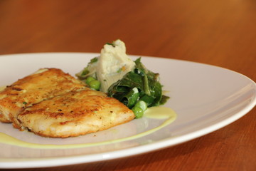 PAN GRILLED DORRY, CRUSHED POTATO, SPINACH, ARTICHOKE, GREEN PEAS, LIME AND TURMERIC AND LIME EMULSION