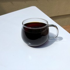 a cup of tea on a white table
