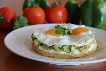 Avocado on Bagel, Fresh avocado, cream cheese on bagel top with your choice of poached eggs or sunny side up eggs