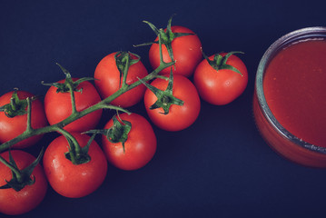 red tomatoes on a vine