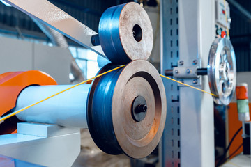 Inside a modern plant producing power electric cables and optical fibers. .Cable manufacturing...