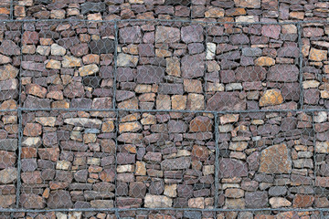Obraz premium stone wall behind a metal grid