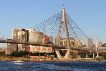 The Anzac Bridge is a cable-stayed bridge that carries the Western Distributor across Johnstons Bay between Pyrmont and Glebe Island, on the western fringe of the CBD of Sydney. Tall buildings