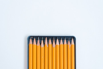 Simple pencils in a box. Background, texture. Geometry. Space for text