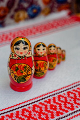 painted nesting dolls on a bright background