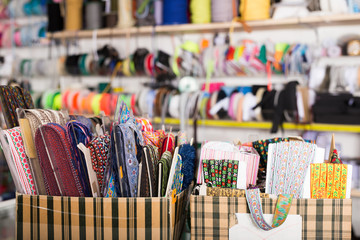 Colored ribbons on needlework store shelves