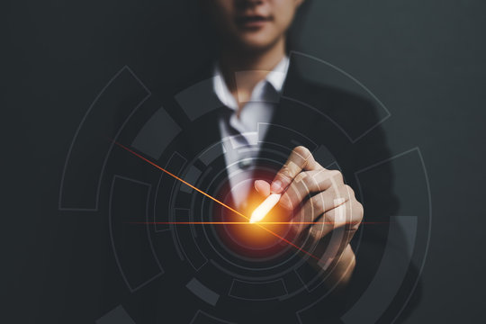 Business woman holding darts with virtual screen dart board .targeting the business concept. - Powered by Adobe