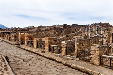 Fototapeta premium Ruins in a street in Pompeii, Italy.